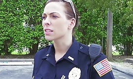 Female cops captivate over unscrupulous suspect and suck his cock